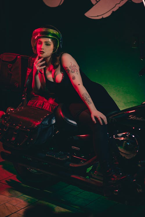 Woman in Black Tank Top Posing on Motorbike