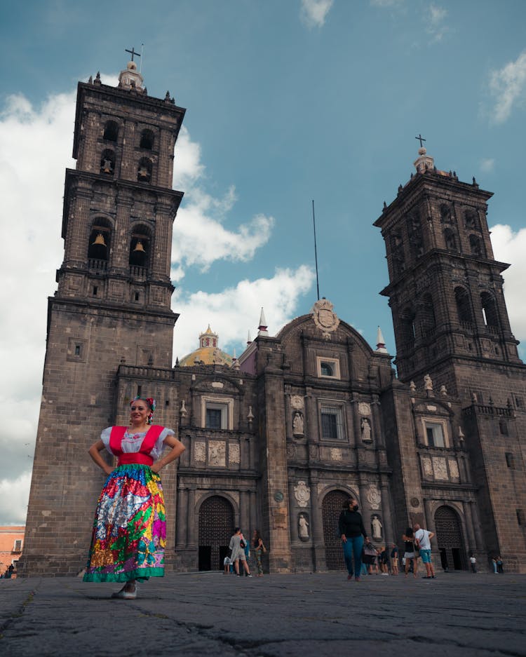 Woman In Regional Dress In Front Of Cathedral In Puebla