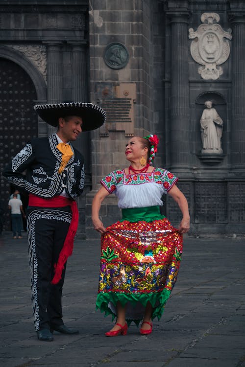 Free Mariachi and a Female Dancer Wearing Traditional Costumes Stock Photo