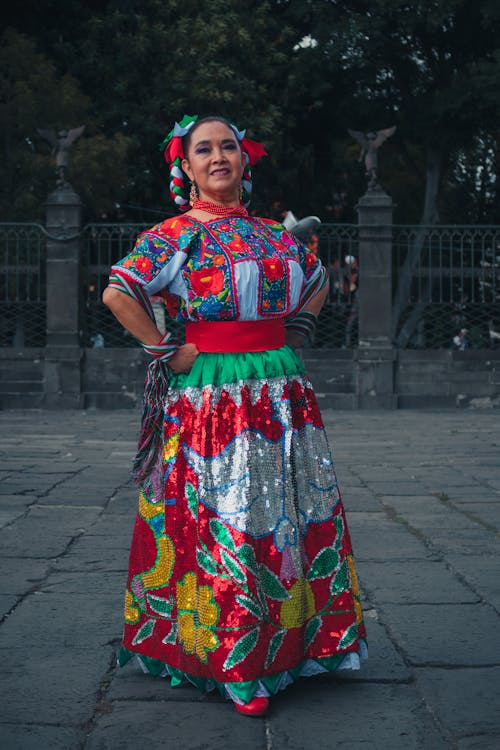 Woman Wearing a Colorful Traditional Dress Smiling