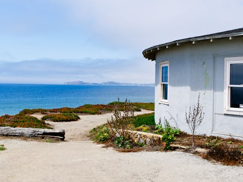 A Gray Building Near Body of Water