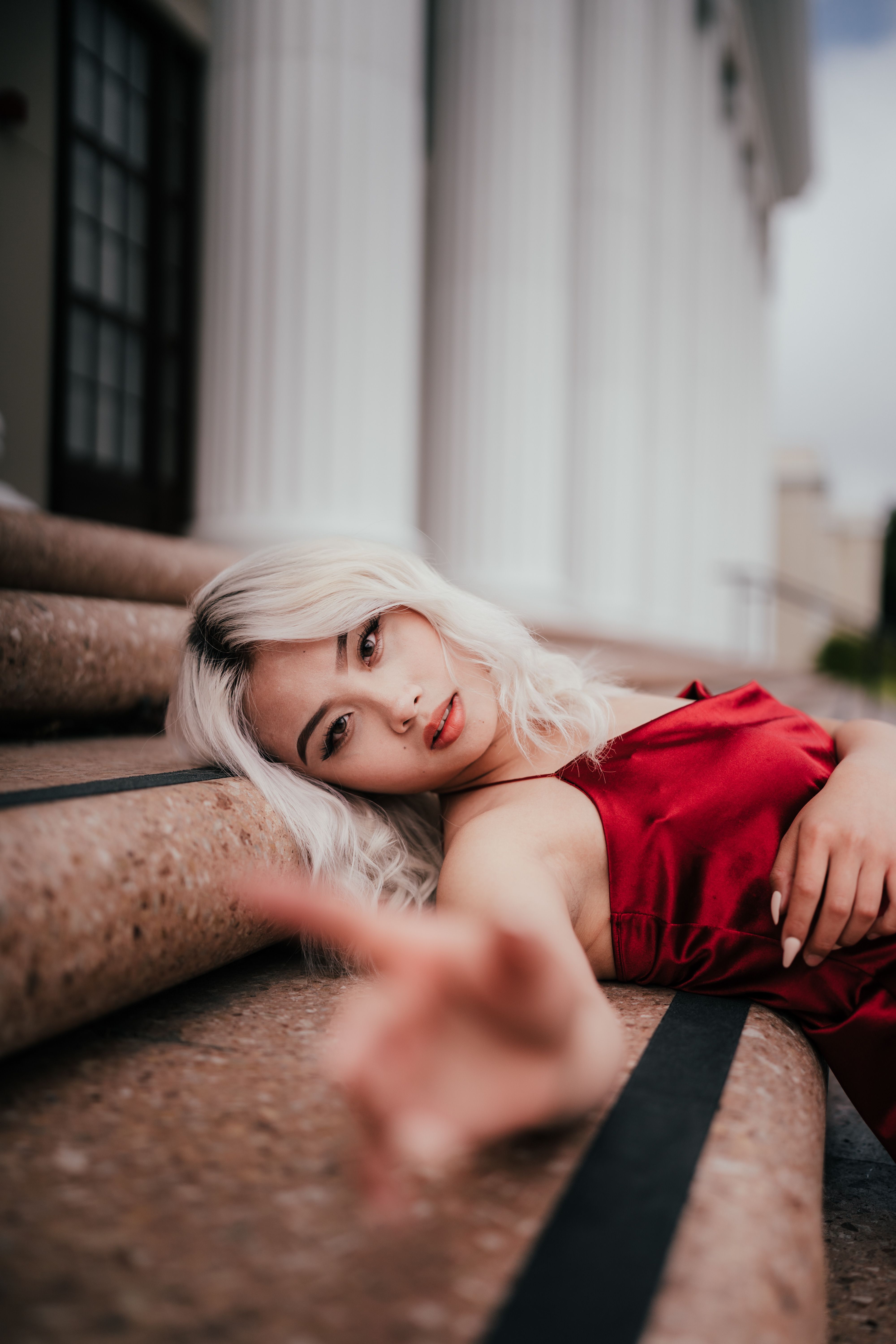 Beautiful Blonde Woman on a Red Silk Dress Posing in City · Free Stock ...