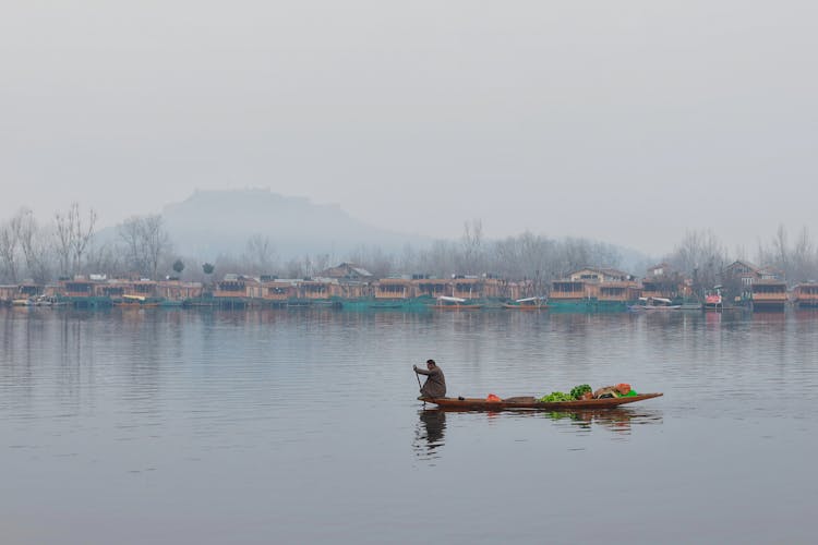 A Person On A Shikara At Dal Lake 