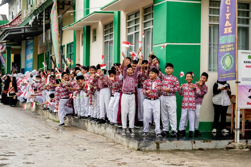Indonesian children waving flags