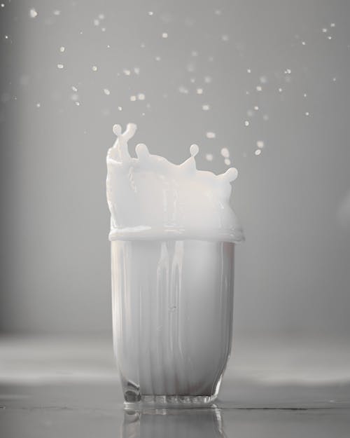 A Milk Splashing on Drinking Glass