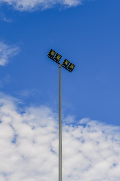 Low-Angle Shot of a Street Light under the Cloudy Blue Sky