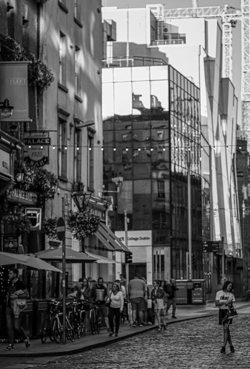 Grayscale Photo of People Walking on the Street