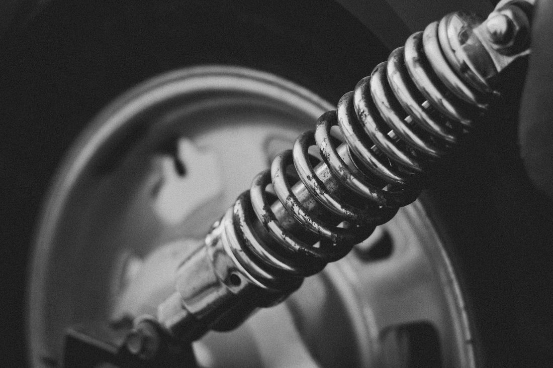 Close-up of a vehicle suspension coil-over unit — photo by Kassia Melo on Pexels