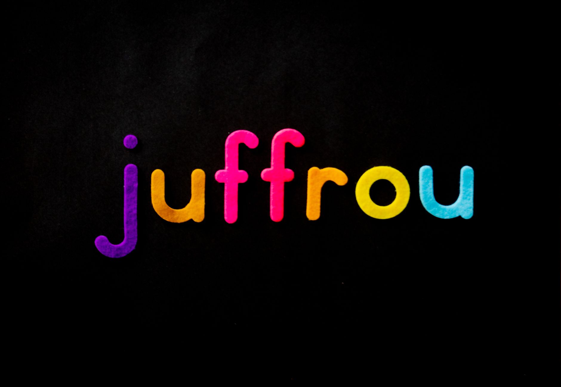 Bright, colorful typography spelling 'juffrou' on a black background.