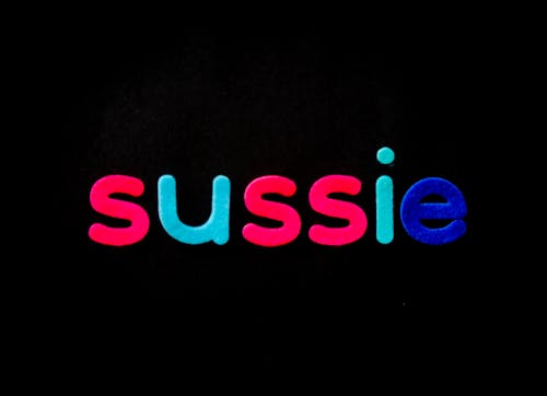 Free Black Background With Sussie Text Overlay Stock Photo
