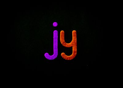 Bright and colorful letters 'jy' pop against a black background, creat — Photo by Magda Ehlers on Pexels