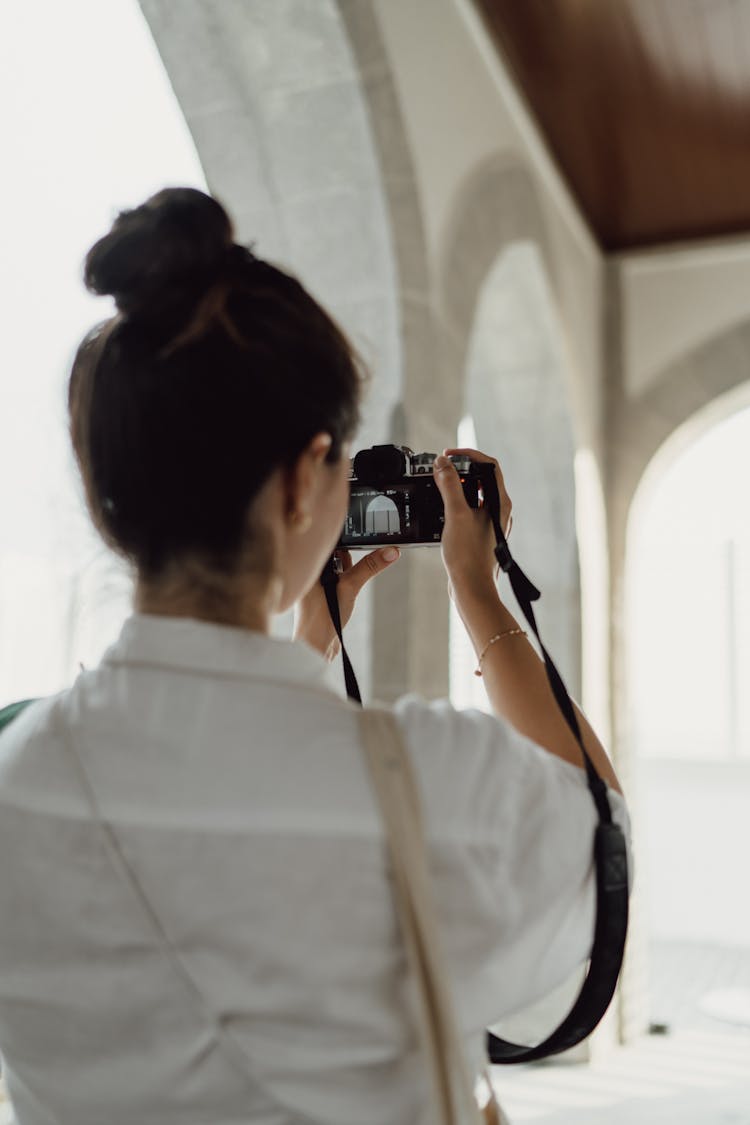 Back View Of Woman Photographing Architecture 