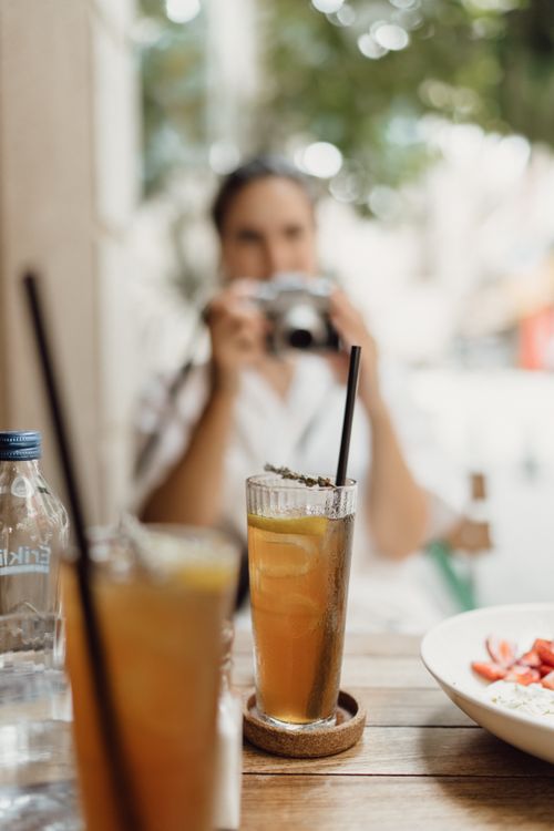 Free Chilled beverages with straws on a wooden table, perfect for a summer day. Stock Photo