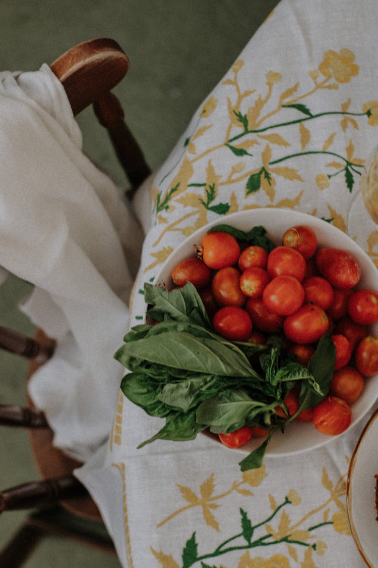 Top View Of Tomatoes And Vegetables On A Bowl