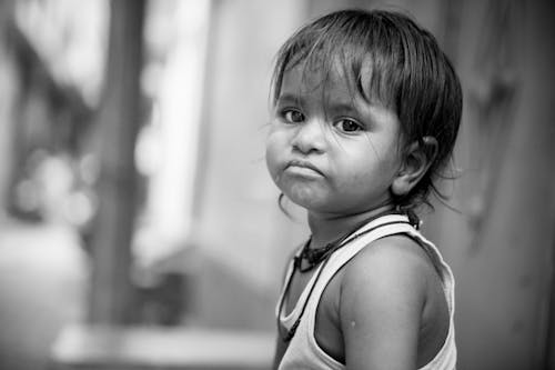 Monochrome Photo of Sad Child 