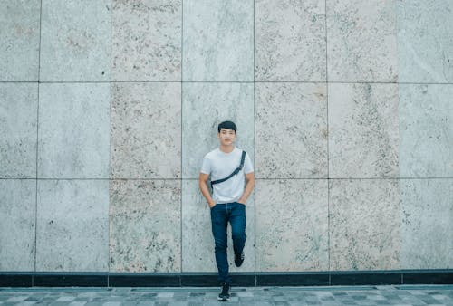 Man Standing Behind Concrete Establishment