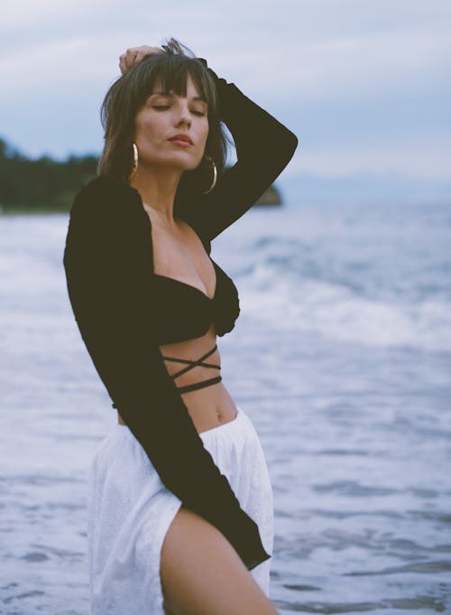 Fashionable Woman Posing on a Beach 