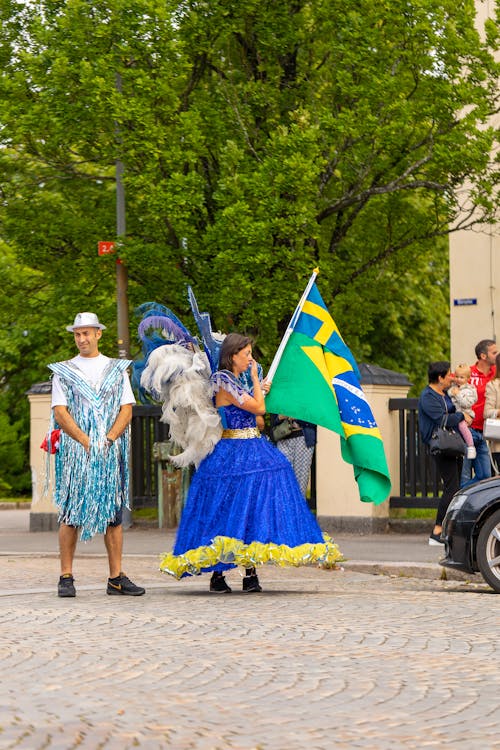 People Wearing Costumes in a Street Parade