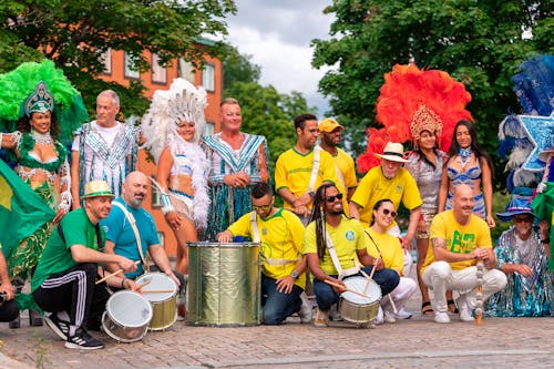 Group of People Wearing Costumes and Musicians on the Street