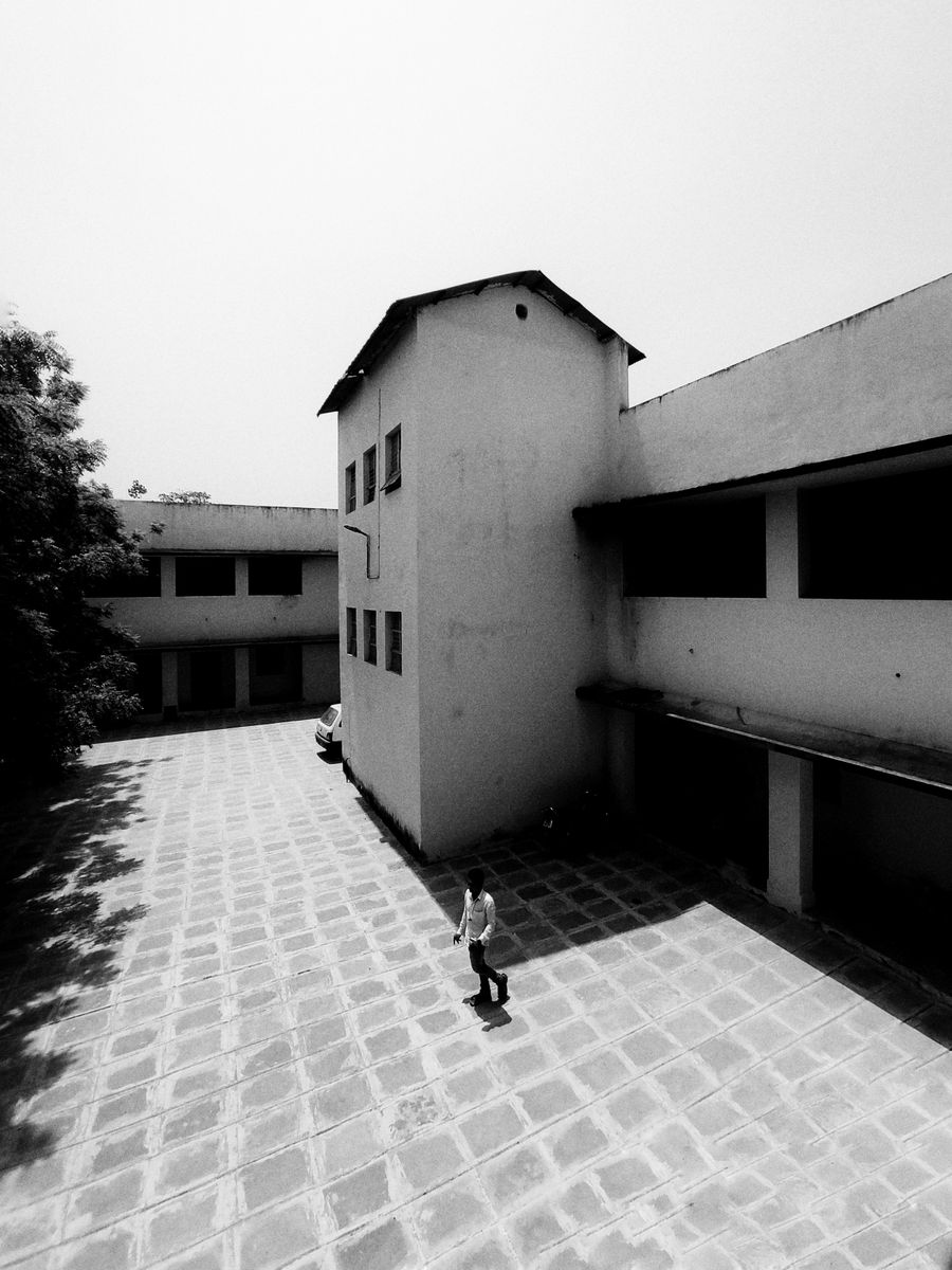Archival photograph of the heritage courtyard classroom where the academy began