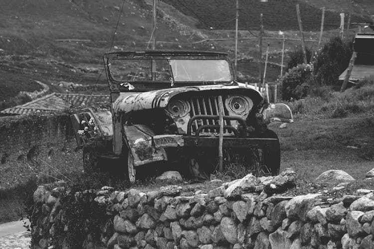 Grayscale Photo Of An Old Jeep