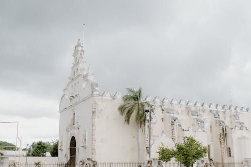 White Church Under Cloudy Sky