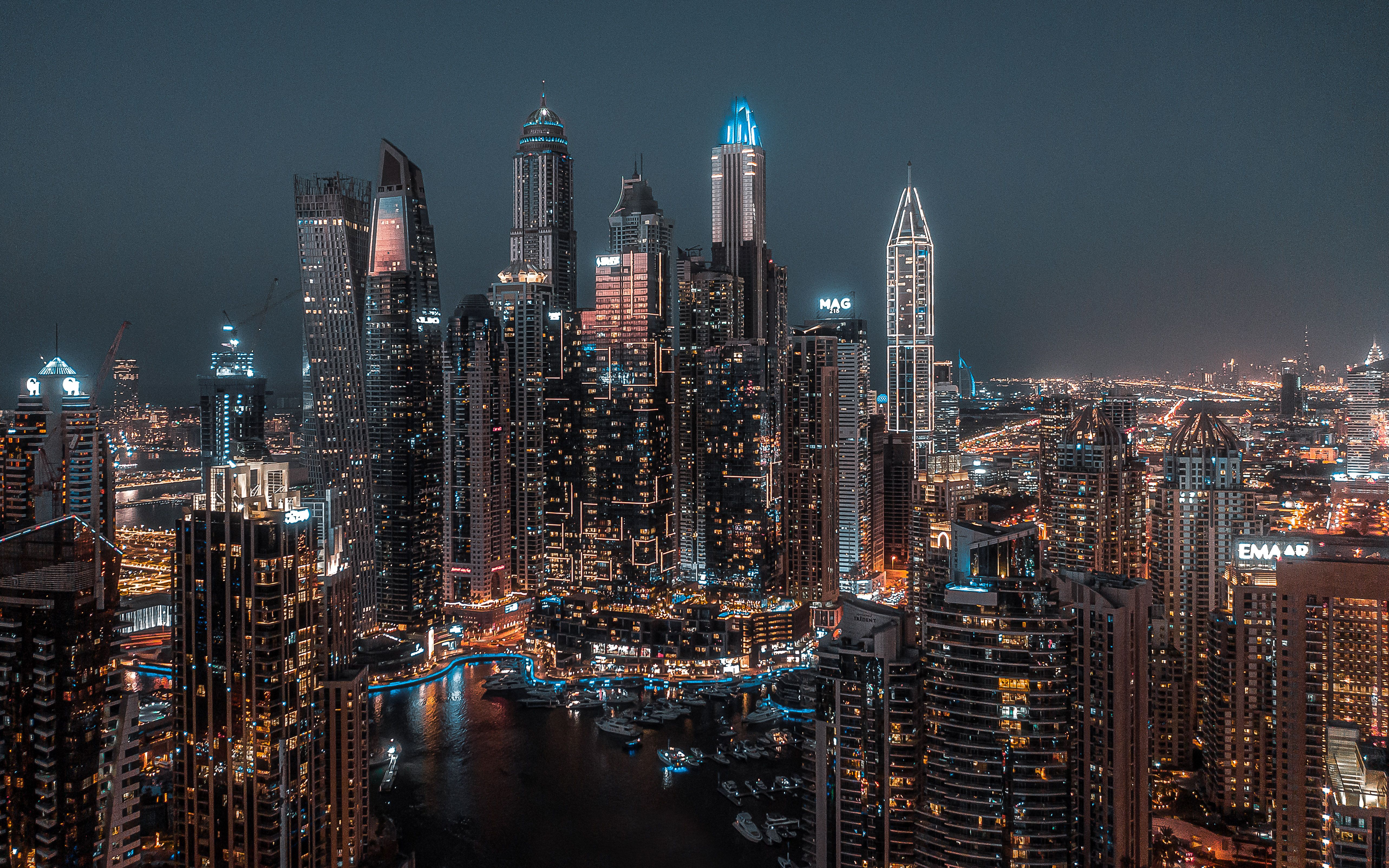 A breathtaking aerial view of Dubai Marina at night showcasing modern skyscrapers and city lights.