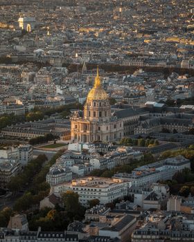 A stunning aerial view of Les Invalides dome in Paris at dusk, showcasing the city's beauty.