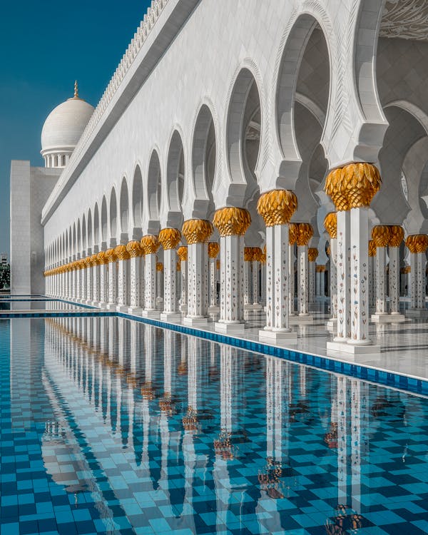 White Concrete Building Beside the Swimming Pool