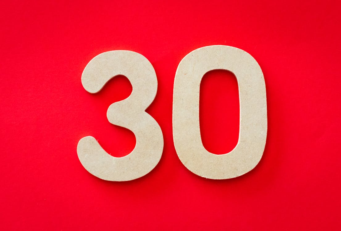 Free Photo of 30 Against Red Backgrund Stock Photo