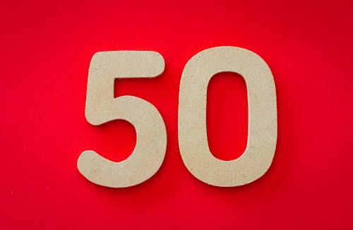 Closeup Photo of 50 Against Red Background