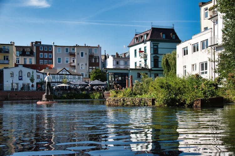 River Near The Buildings In The Town