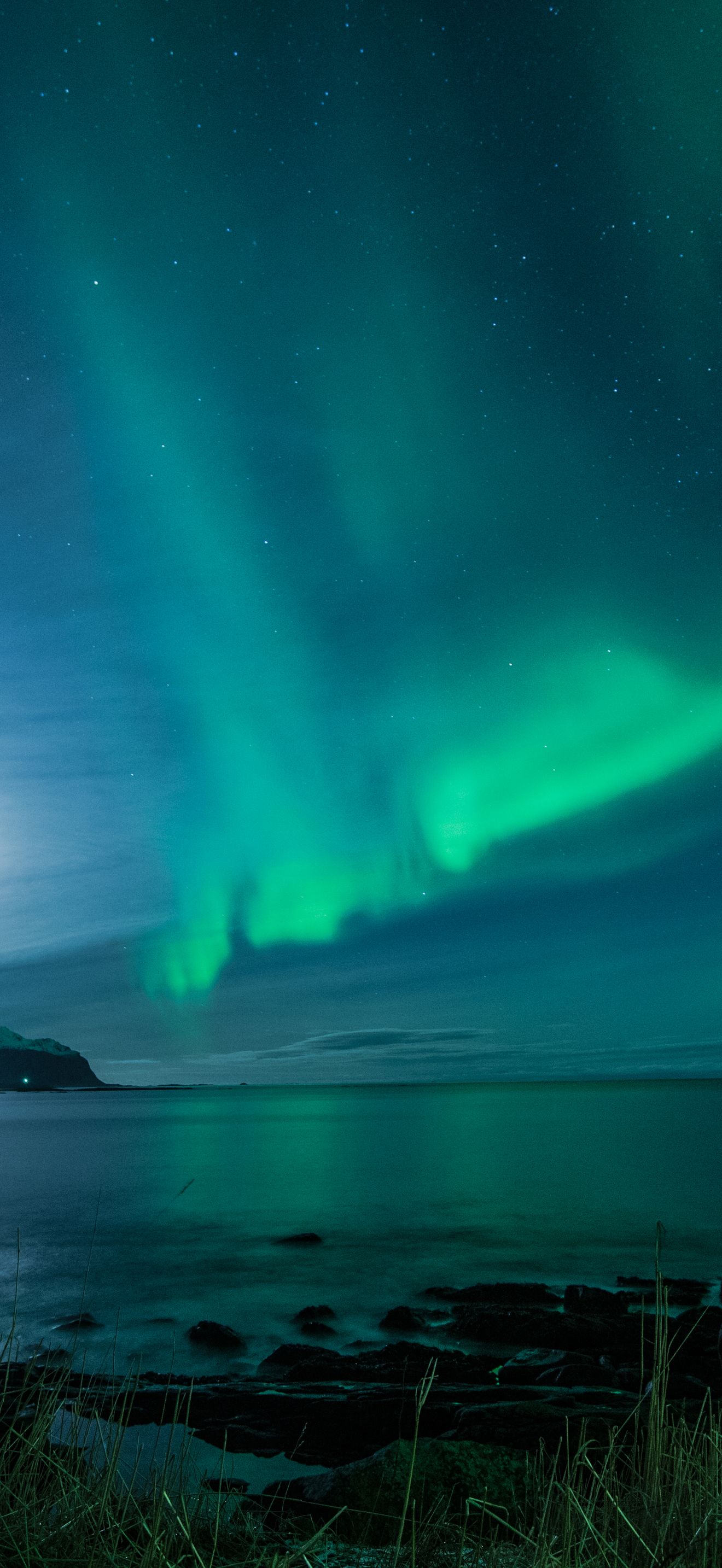 Green Northern Lights Over Mountains and Calm Water 4K iPhone 17 Wallpaper