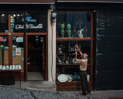 An Elderly Man Opening the Store