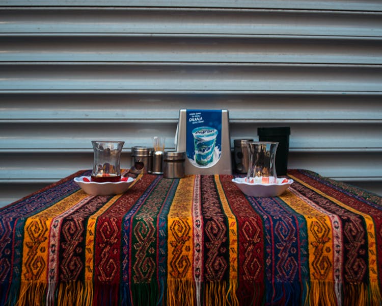 Restaurant Table Set With Colorful Tablecloth