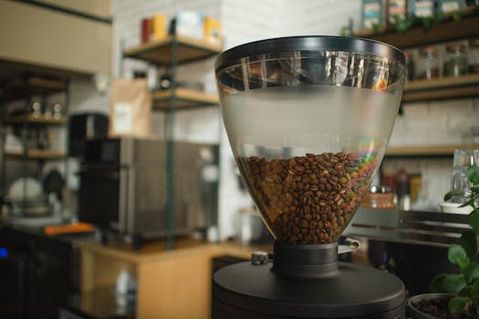 Close-up of coffee beans in a grinder at a cozy café in Eskişehir, Turkey.