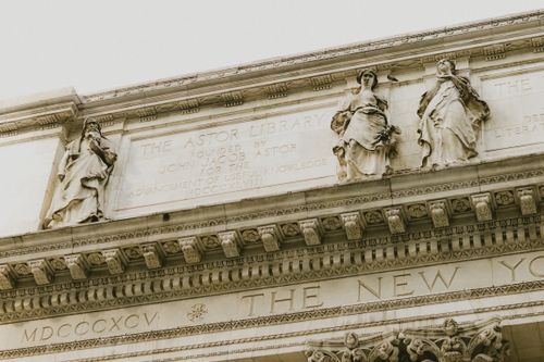 Free Low angle view of Astor Library facade featuring detailed sculptures and inscription in New York City. Stock Photo