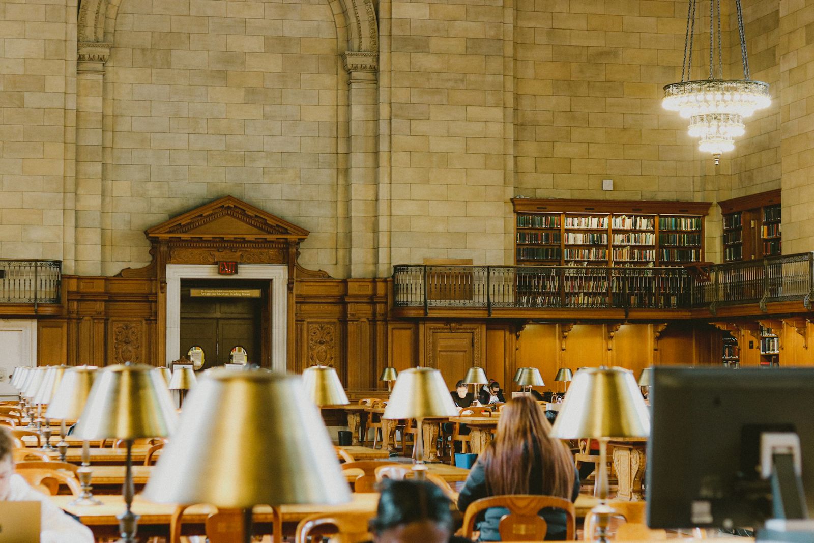 Grand reading hall with rows of wooden tables