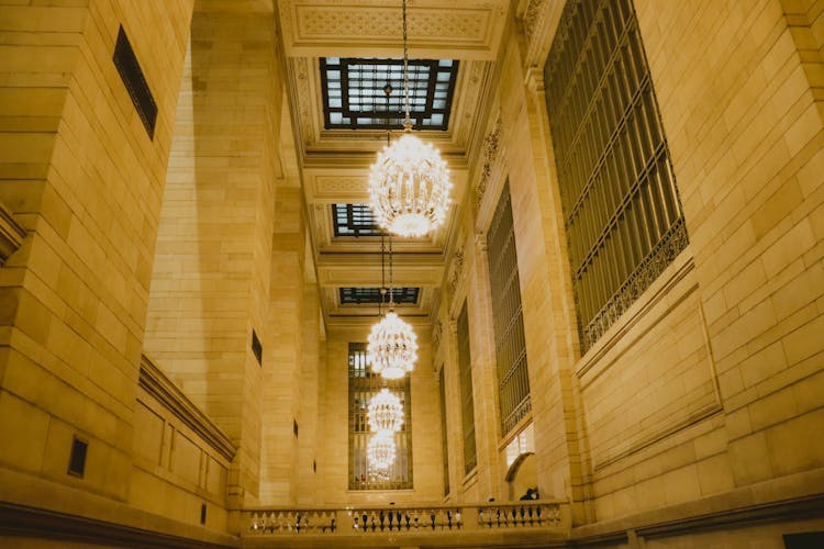 Low Angle Shot Of Lighted Chandeliers 