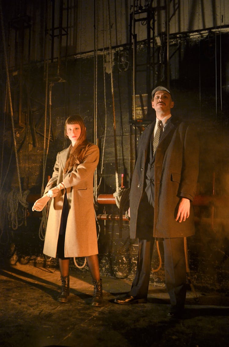 Couple In Coats Posing In Abandoned Building