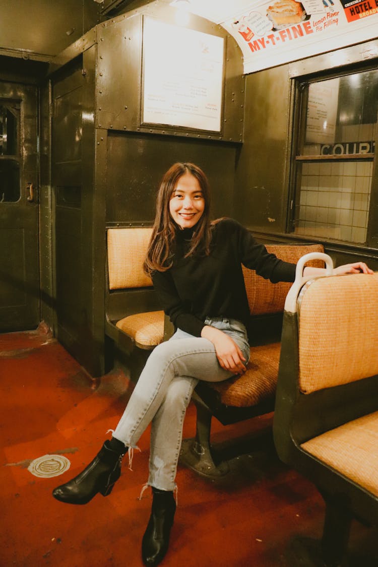 Brunette Girl Sitting In A Vintage Train