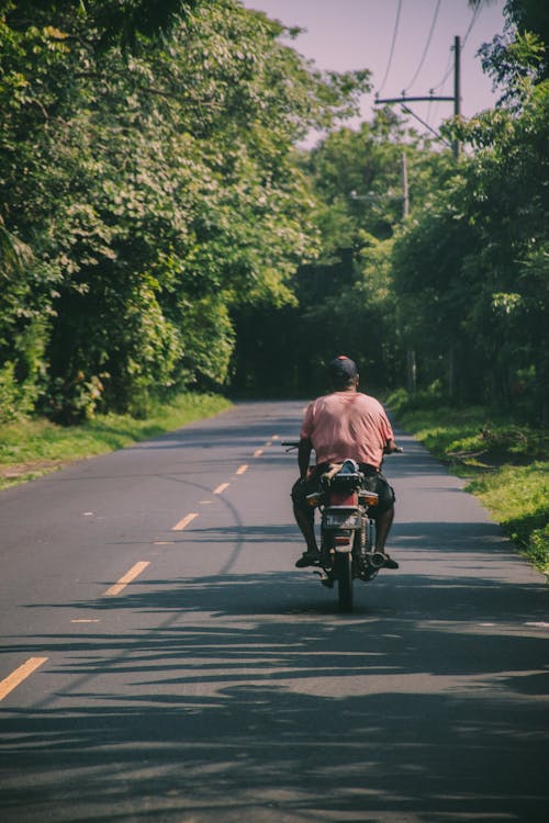 Backview of Man riding a Motorcycle 