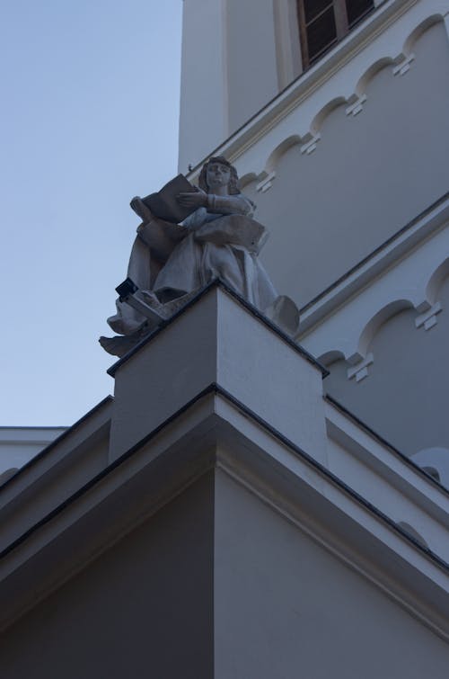 Low-Angle Shot of a White Concrete Statue