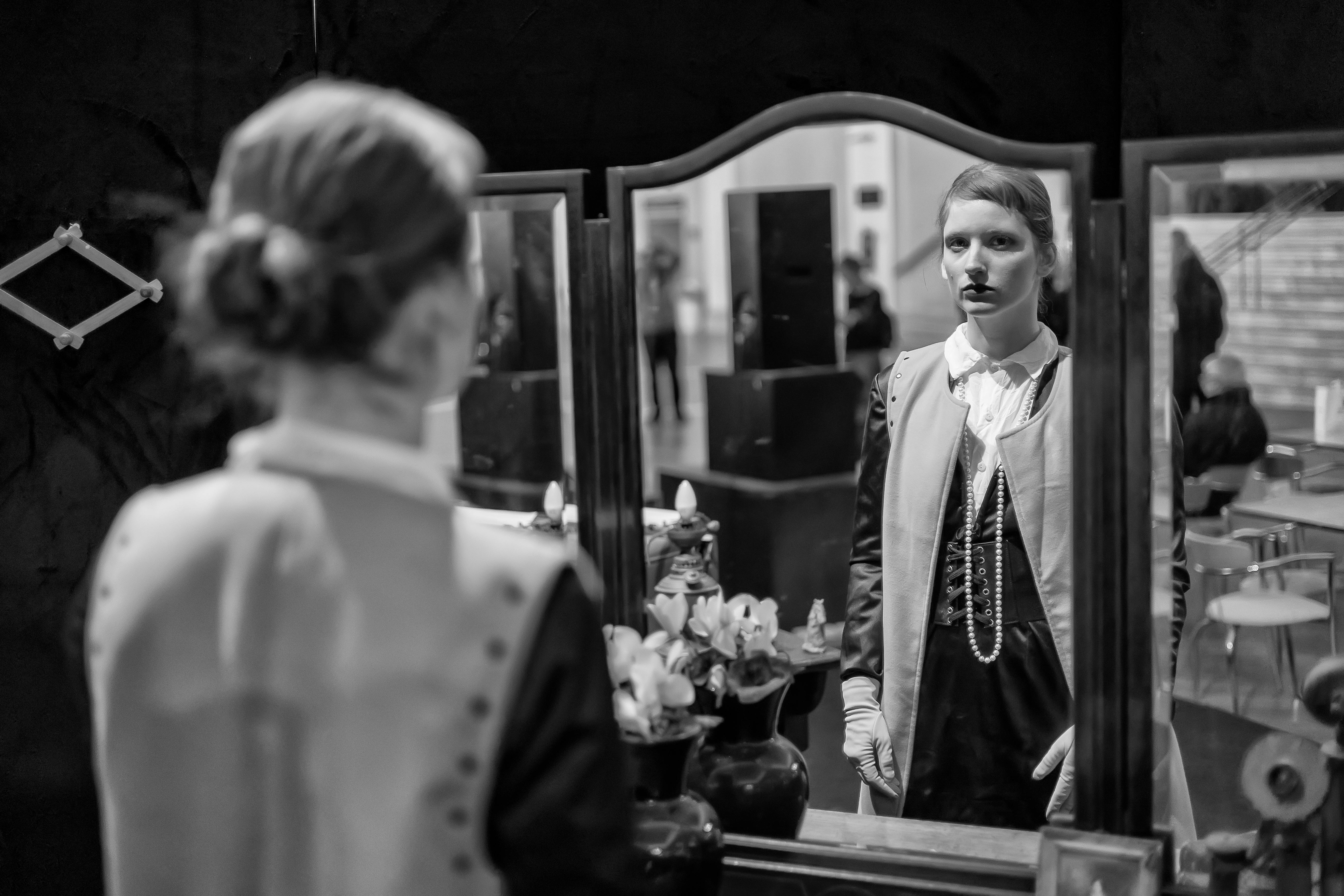 woman wearing stage costume reflected in mirror