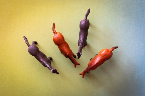 Free Top-down view of colorful miniature horse toys arranged on a gradient background. Stock Photo