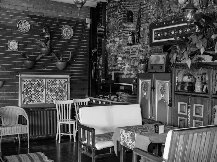 A Grayscale Of An Interior Of A Cafe