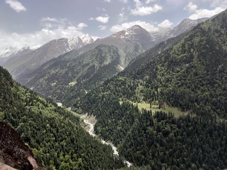 An Aerial Shot Of A Valley With A River