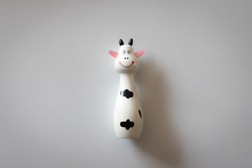 White and Black Cow Figurine