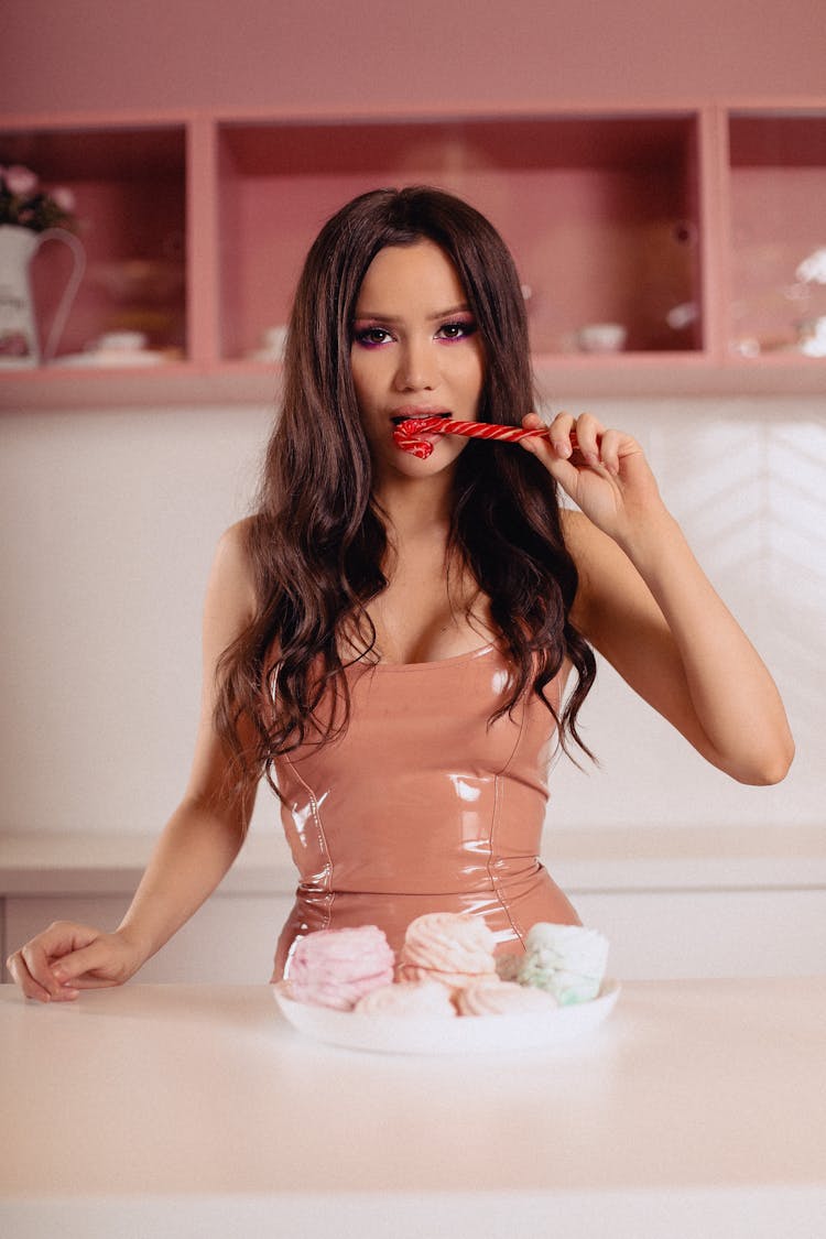 Woman Eating Candy Cane Lollipop