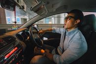 Man Wearing Light Blue Button-down Dress Shirt Driving Vehicle